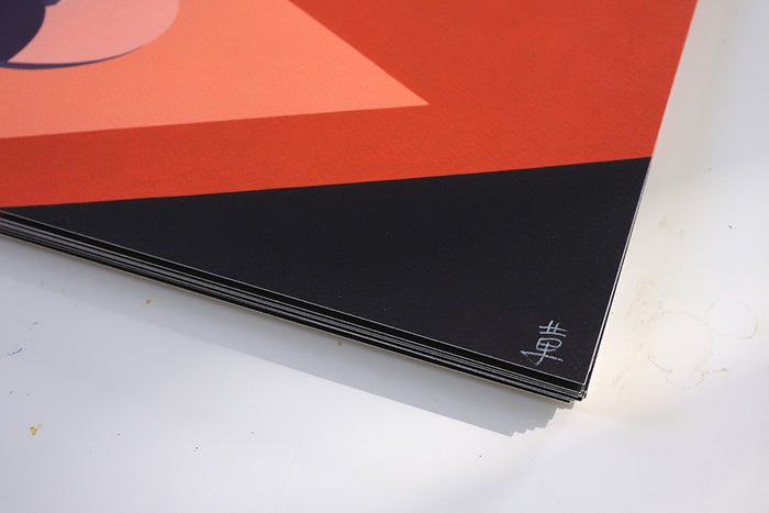 A close-up of Adrian Kay Wongs limited edition Cherry print displays geometric orange and black patterns on a light surface, with a small signature adding an exclusive touch.