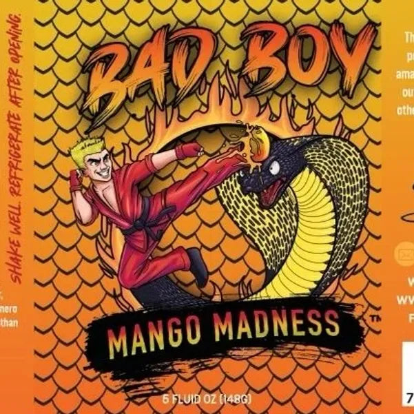 Bad Boy Mango Madness beer can label with illustrated character fighting cobra on gold scale pattern background