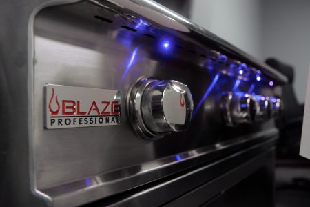 Blaze Professional stainless steel grill control panel with blue LED lights and illuminated knobs