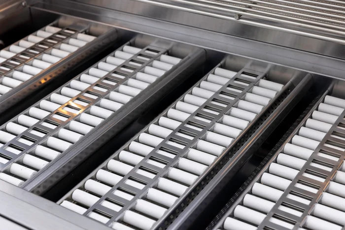 Stainless steel grill burners with ceramic briquettes and metal flavorizer bars in multiple rows