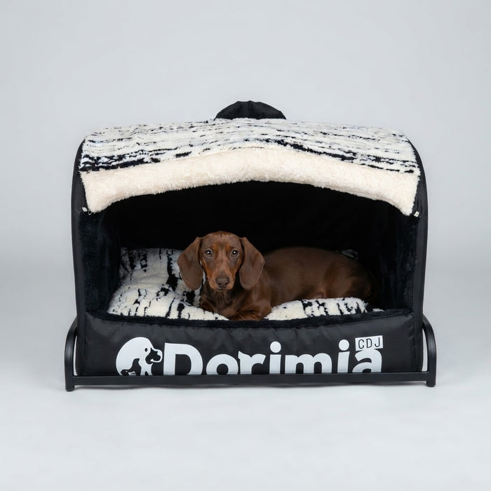 Dachshund resting in a cozy enclosed black dog bed