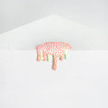 Dan Lams Mini #26 showcases a textured white wall with a dripping pattern reminiscent of melting pink and green slime, accented by small raised pink dots, all set against a light gray background resembling the smooth finish of resin.