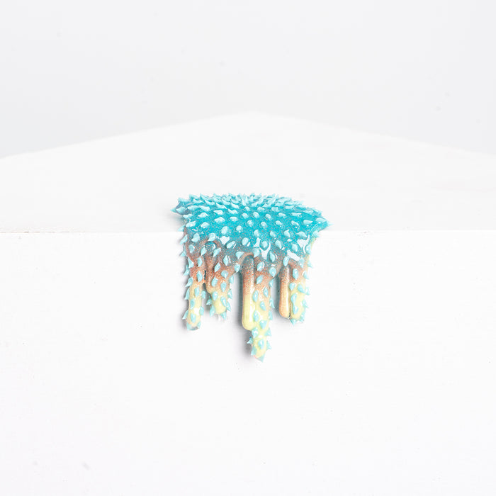 Dan Lams Mini #27 features a turquoise-to-beige gradient resembling upside-down icicles or dripping paint with spikes, set against a white background and crafted to mimic hot glue.