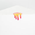 The Dan Lam Mini #31 white envelope features a colorful adhesive strip with a yellow and pink dripping design and small textured star shapes, all with a resin-like sheen.