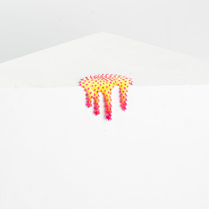 The Dan Lam Mini #31 white envelope features a colorful adhesive strip with a yellow and pink dripping design and small textured star shapes, all with a resin-like sheen.