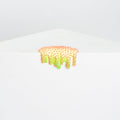 Dan Lams Mini #39 features a bright, textured object that resembles dripping paint in fluorescent pink and green, oozing like hot glue over the edge of a stark white geometric surface against a light gray background.