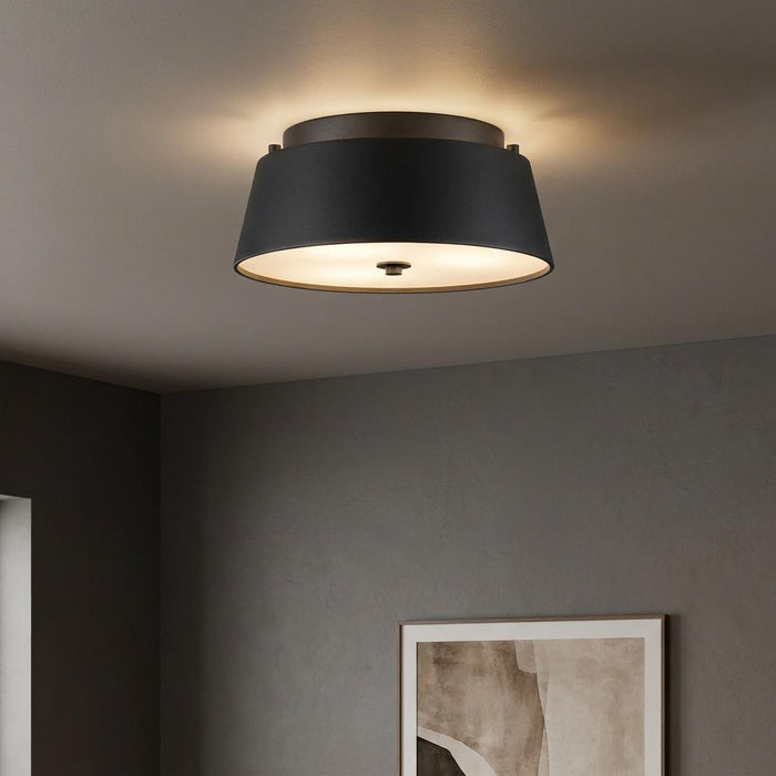 Feiss Asher black flush mount ceiling light with a white diffuser, illuminating a modern gray room.