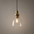 Elegant pendant light with a driftwood gold finial and clear glass bell shade, showcasing a warm vintage bulb.