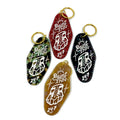Set of five GATS "Paint INN 24.7" keychains by GATS, each in a different color (red, green, black, brown, blue) with gold key rings and a white graphic featuring the iconic hand holding a paintbrush—ideal for fans of vintage-inspired acrylic keychains with nostalgic flair.