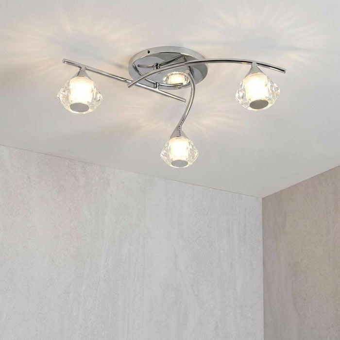 Meissa chrome 3-light semi-flush bathroom ceiling light with faceted crystal shades on a white ceiling.