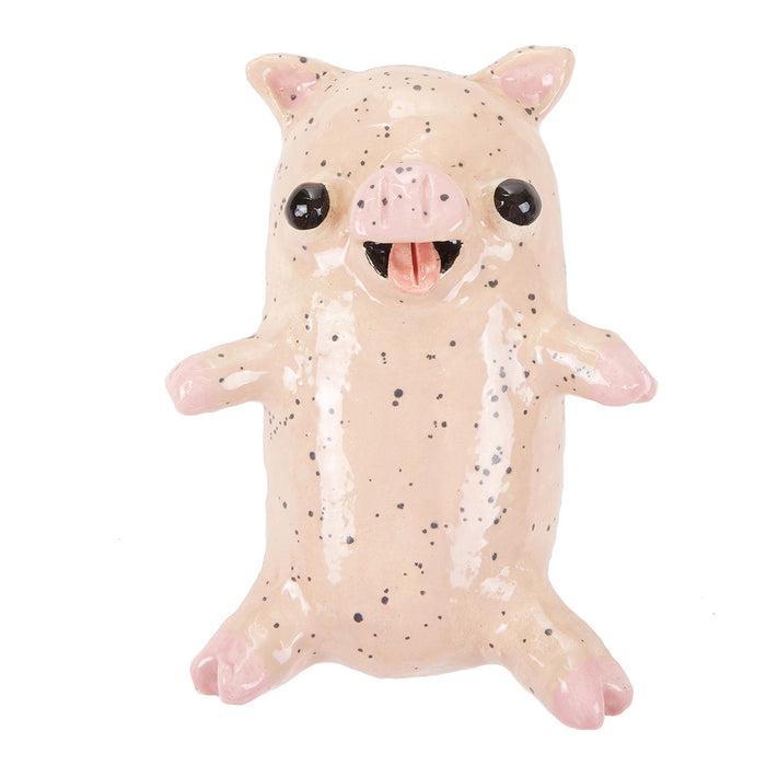The Pepper Piglet by Katie Kimmel for Hashimoto Contemporary is a whimsical small speckled ceramic sculpture featuring black eyes, a pink snout, and an open mouth. With its stubby legs and beige skin accented by darker speckles, this charming piece stands upright.