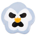 The Periwinkle Pansy ceramic plate by Lorien Stern at Hashimoto Contemporary resembles a pansy flower, with a pale blue outline, black petal details, and a vibrant yellow center, all in a simple and stylized design that captures natures delicate beauty.