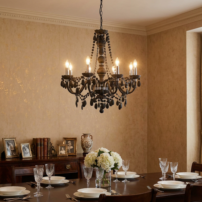 Eight-light grey acrylic chandelier with decorative beads hanging above a formal dining table in a classic room.