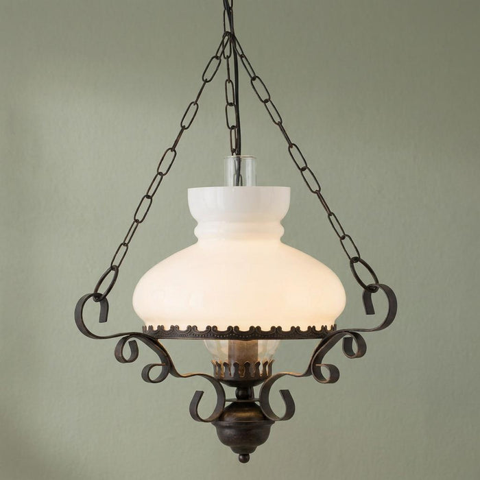 Rustic oil lantern ceiling pendant featuring a white frosted glass shade and ornate bronze metal scrollwork.